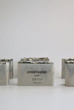 Load image into Gallery viewer, Detox. Green Dead Sea mud soap + black swirls of activated charcoal. Vellum paper packaging.