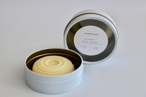 Large Lavender + Sweet Orange lotion bar with reusable white and gold tin. Ishtahfeetah Soapery.