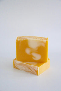 Yellow handcrafted, natural soap, scented with peppermint & sweet orange essential oils.