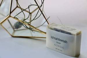 Nordic handcrafted soap by Ishtahfeetah soapery. White soap swirled with blue indigo + French green clay.