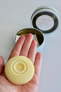 Lotion bar in hand - approximate size of your palm. Ishtahfeetah Soapery.